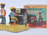 toy figurine of a man and a woman playing a piano
