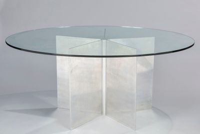 a clear glass table with a star shaped base and a clear glass top