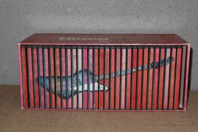 a box with a guitar inside of it on a table