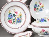 many different types of china dishes and bowls on the table