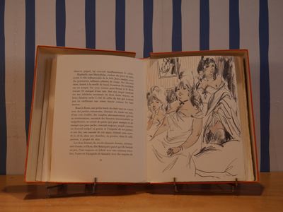 un livre ouvert sur lequel figure le dessin d'un groupe de personnes