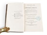 an open book with a gold handle on it