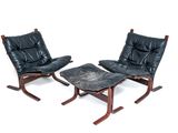 pair of black leather lounge chairs and ottoman on wooden legs