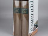 the two books are in the box on the table