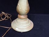 a lamp that is sitting on a table with a cord around it