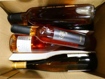 many bottles of wine in a box on the table