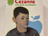 une image représentant un livre sur lequel figure l'illustration d'un garçon devant une pomme