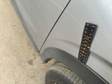 a sticker on the side of a car with a ruler attached to it