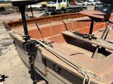a boat that is sitting on the ground in the dirt