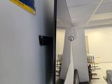 a flat screen tv hanging on the wall in the living room
