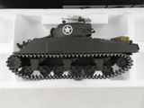 a toy tank in a white box on a table
