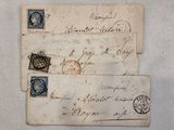 an old letter with a stamp on it sitting on top of a piece of paper