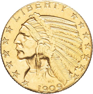 un gros plan d'une pièce d'or sur laquelle figure une tête d'Indien
