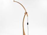 a wooden floor lamp with a white shade on top of it