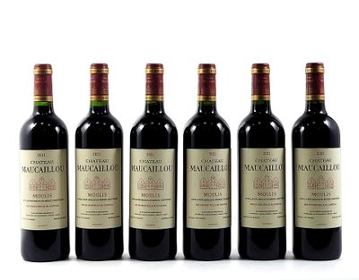 six bottles of red wine lined up in a row on a white surface