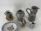a lot of small vases and plates on the table