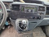 a dashboard of a vehicle with a steering wheel and dashboard controls