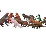 tout un tas de dinosaures en peluche alignés les uns à côté des autres