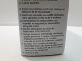 a bottle of liquid sitting on a table