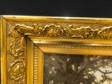 a picture of a painting of a tree in a gold frame
