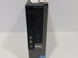 a close up of a dell desktop computer on a white surface