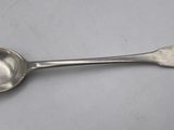 silver plated spoon with a spoon handle on a white surface
