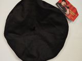 a black hat on a white table with a red tag