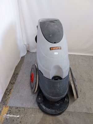 a machine that is sitting on the floor next to a wall