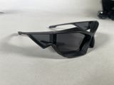 sunglasses on a table with a pair of glasses on top of it