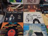 a lot of vinyl records on the table