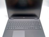 an open laptop computer sitting on top of a white table