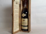 an open wooden box with a bottle of wine inside of it