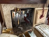 a fire place in the middle of a living room with a fireplace