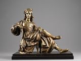 an image of a bronze statue of a woman holding a child