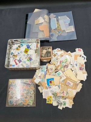 many different types of stamps on the table