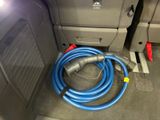 a hose that is connected to a hose in the back of a car