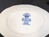 a white plate with a blue and white design on it