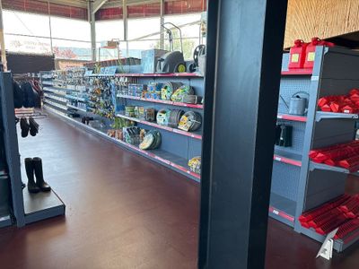many shelves in the store that are filled with items