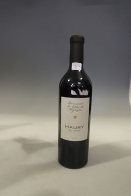 a bottle of wine sitting next to a glass of wine
