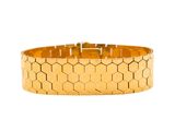a close up of a gold bracelet on a white background