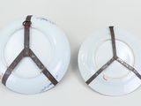 two plates with a peace sign on them on a table