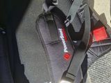 a backpack that is sitting on the ground next to a bag