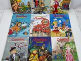 a bunch of children ' s books sitting on top of a white table