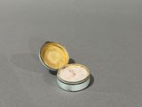 two tins that are sitting on a table