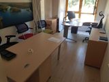 an image of a home office with a desk and chairs