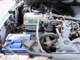 a picture of a car engine with its hood open