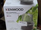 packaging of a blender sitting on top of a counter next to a coffee pot