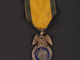 a close up of a medal with an eagle on it