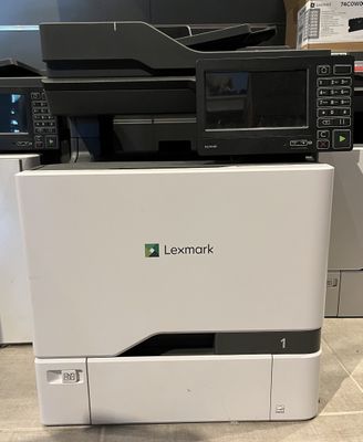 the printer is sitting on the floor in front of the other printers