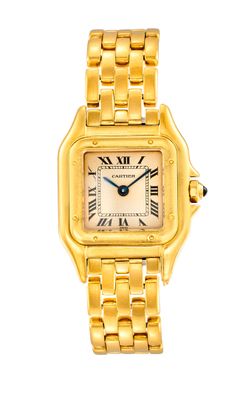 gros plan d'une montre-bracelet en or avec des chiffres romains